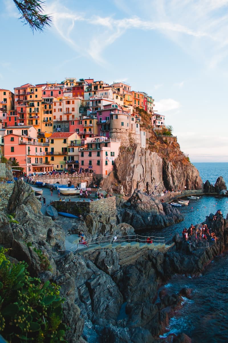 Golden-hour view over the painted cliffside houses of Manarola